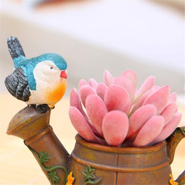 Handcrafted watering can container with bird design flower planter