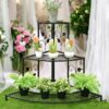 Metal plant stand with tiered shelves for indoor plants
