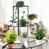 Stylish metal corner plant stand with decorative floral design