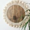 Bohemian macrame wall mirror with handcrafted fringe detailing