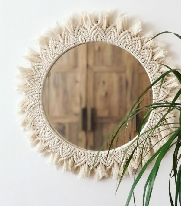 Bohemian macrame wall mirror with handcrafted fringe detailing