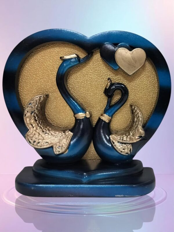 Love-inspired swan statue couple with heart-shaped frame