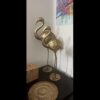 Antique brass crane sculpture symbolizing grace and beauty