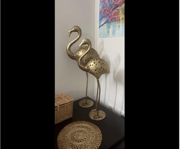 Antique brass crane sculpture symbolizing grace and beauty