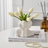 Artistic white face vase made of ceramic for home decor inspiration