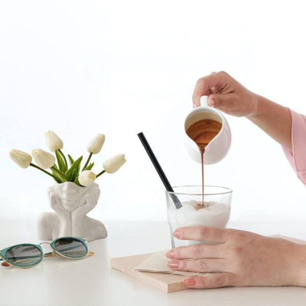 Elegant white ceramic small vase used as flower holder