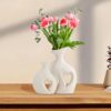 Beautiful white ceramic vase in heart shape design