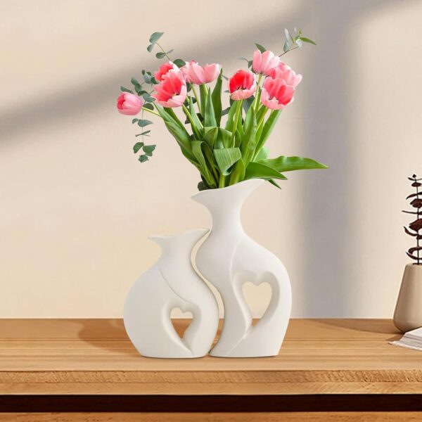 Beautiful white ceramic vase in heart shape design