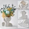 Minimalist white face-shaped ceramic vase for dried flowers or pampas grass