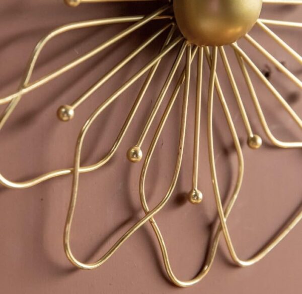 Artistic gold metal wall hanging designed for modern interiors