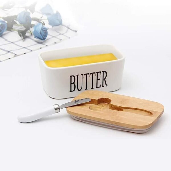 Modern butter container with wooden lid keeping butter fresh