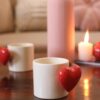 Elegant red ceramic heartbeat mug featuring a heart-shaped handle and pop-up heart inside.