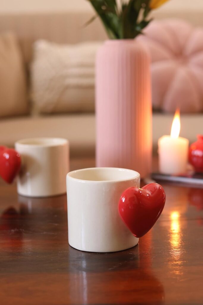 Elegant red ceramic heartbeat mug featuring a heart-shaped handle and pop-up heart inside.
