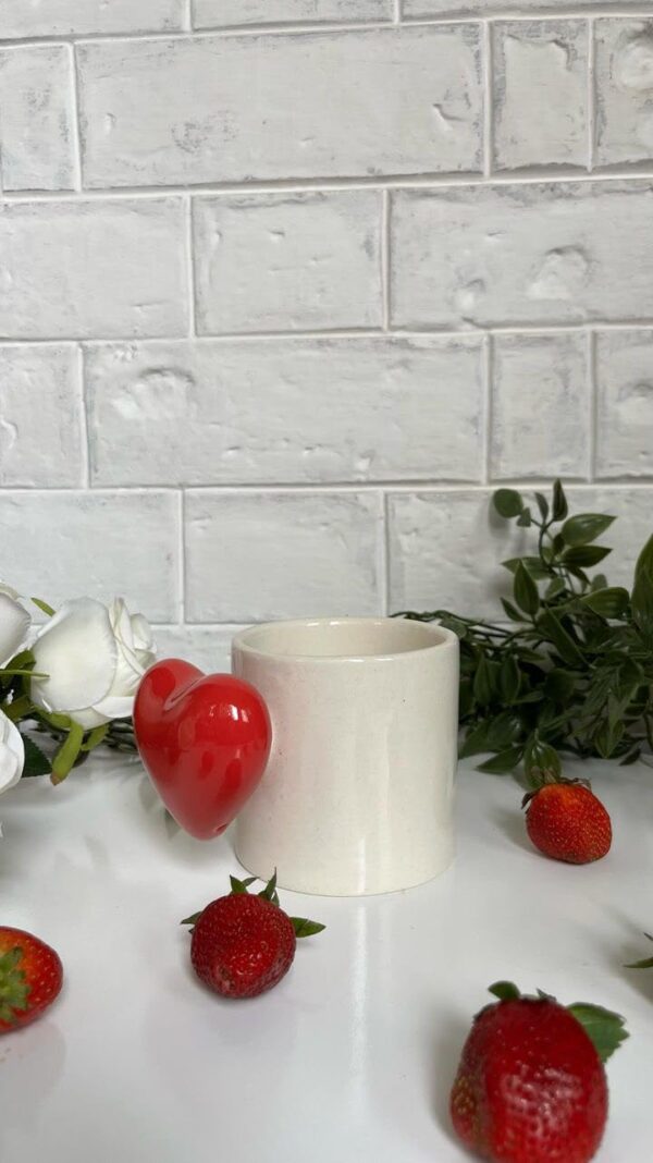 Stylish ceramic heartbeat mug in red with an inner pop heart, ideal for romantic occasions.