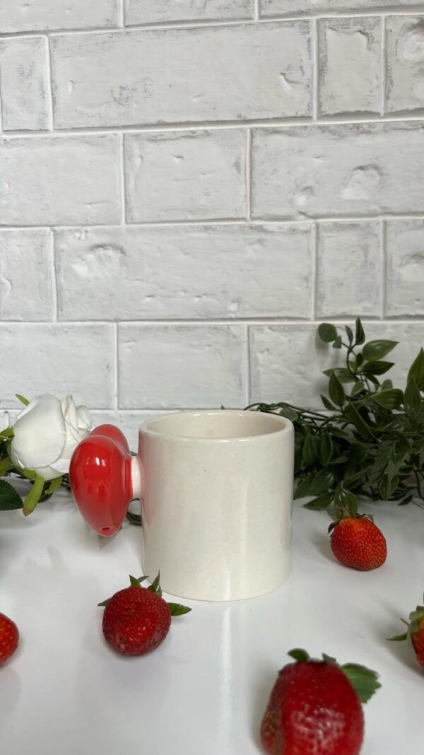 Ceramic mug with love heartbeat design, featuring a red heart handle and pop-up inner heart.