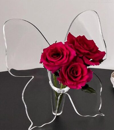 Clear acrylic butterfly vase for flowers on tabletop