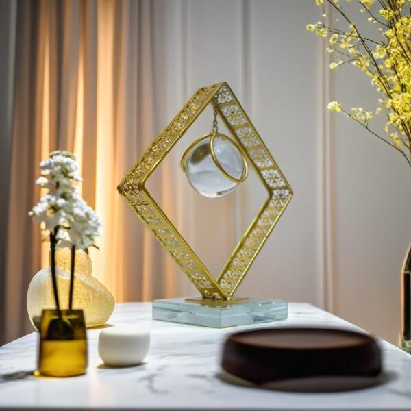 Transparent crystal globe with glowing LED light and gold metal stand