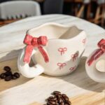 Cute handmade ceramic mug with realistic 3D bow, Pinterest-style hand-painted finish