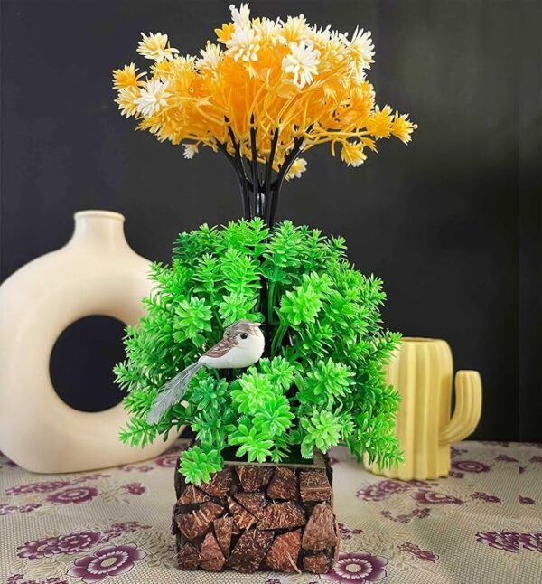 Small fake plants with multicolor artificial flowers in coconut wooden pot