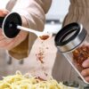 Glass spice jar with spoon and lid for hygienic storage