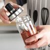 Transparent spice jar with airtight lid and spoon for easy seasoning