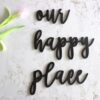 Matt black “Our Happy Place” wooden round wall hanging décor