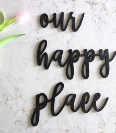 Matt black “Our Happy Place” wooden round wall hanging décor