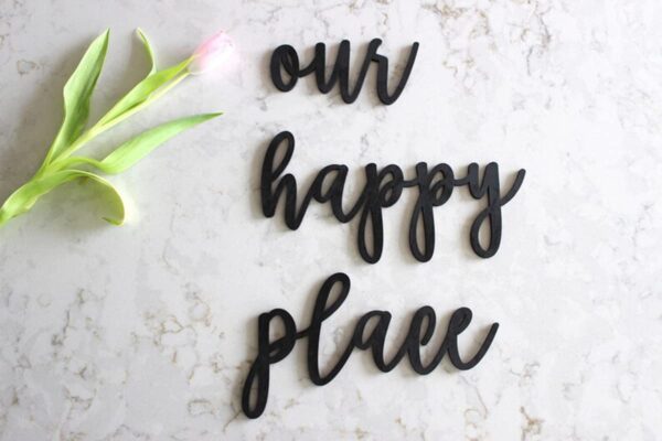 Matt black “Our Happy Place” wooden round wall hanging décor