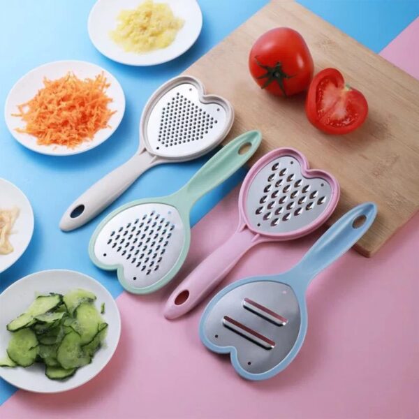 Multi purpose heart design food grater with four blades