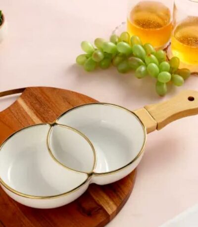 White ceramic snack plate and wooden handle serving bowl