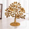 Golden brass tree sculpture symbolizing growth and prosperity