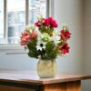 Rustic wooden vase filled with colorful dried faux flowers