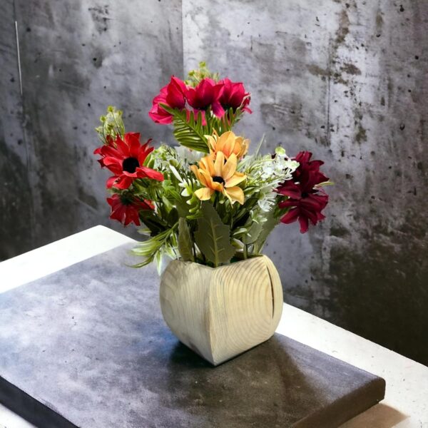 Designer wooden pot containing assorted artificial dry florals