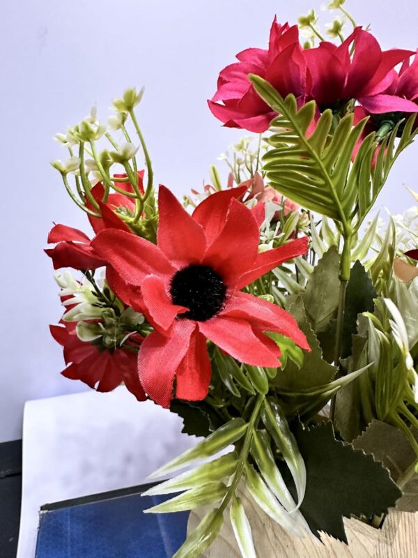 Aesthetic artificial dry flowers arranged in wooden planter