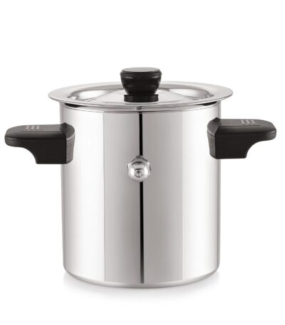 Shiny stainless steel milk cooker pot with handle and lid on kitchen counter