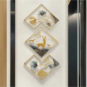 Metal deer wall art set hanging on living room wall