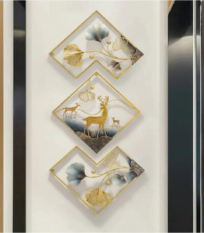 Metal deer wall art set hanging on living room wall