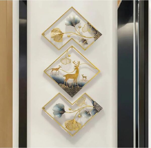 Metal deer wall art set hanging on living room wall