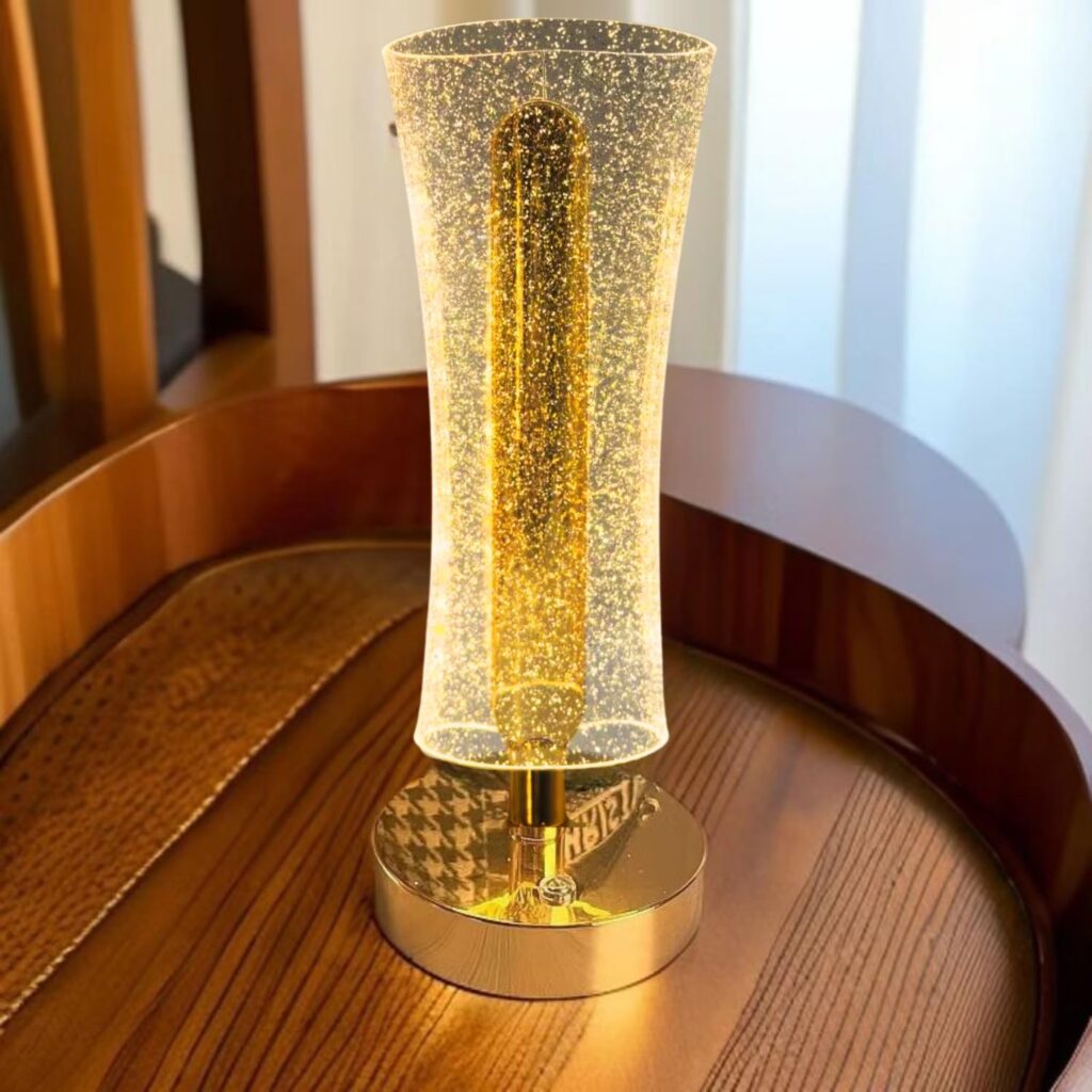 Acrylic LED night lamp with gold base providing soft ambient lighting for bedrooms