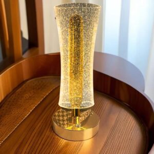 Acrylic LED night lamp with gold base providing soft ambient lighting for bedrooms