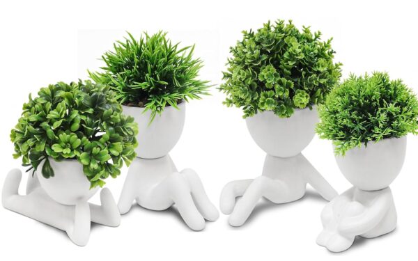 Four artificial succulent plants in cute ceramic human-shaped pots for home decoration.