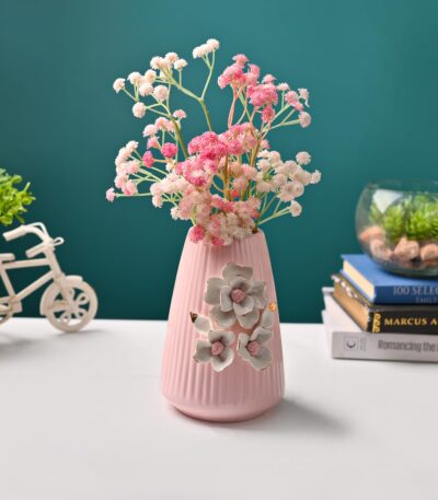 Pink ceramic vase with engraved ribbed floral pattern