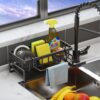 Close-up of metal sponge holder attached to kitchen sink for organization.