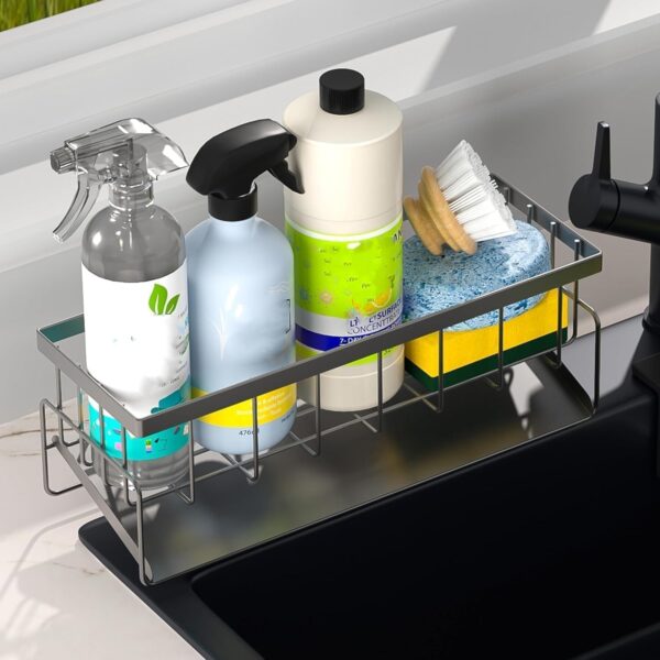 Metal sponge holder placed near faucet for easy dishwashing access.