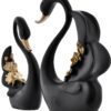 Stylish swan couple figurine placed on a living room shelf