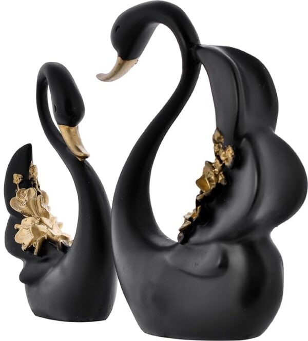 Stylish swan couple figurine placed on a living room shelf