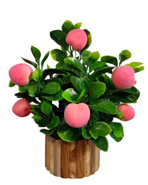 Bright decorative artificial fruit plant in pot