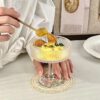Crystal clear European tall ice cream dish with fruit and nuts