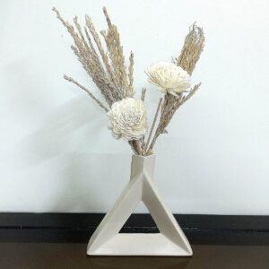 Stylish ceramic triangle flower vase with artificial floral arrangement