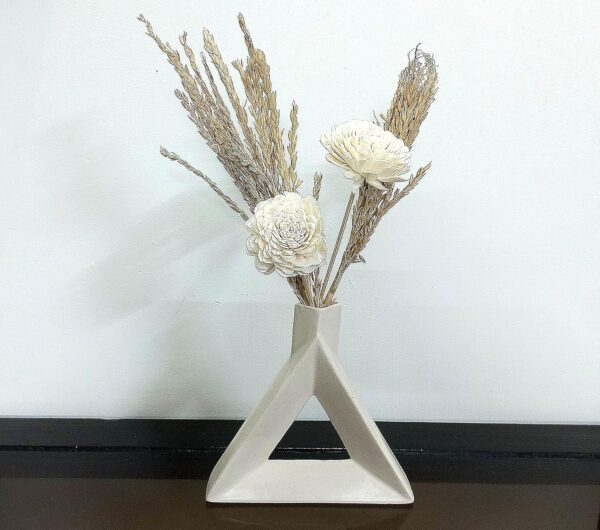 Stylish ceramic triangle flower vase with artificial floral arrangement